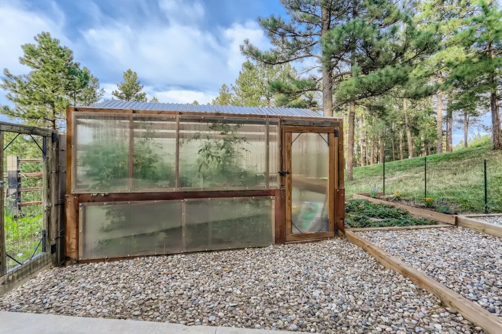 A property features a greenhouse