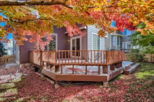 Beautiful fall colored leaves surround a home